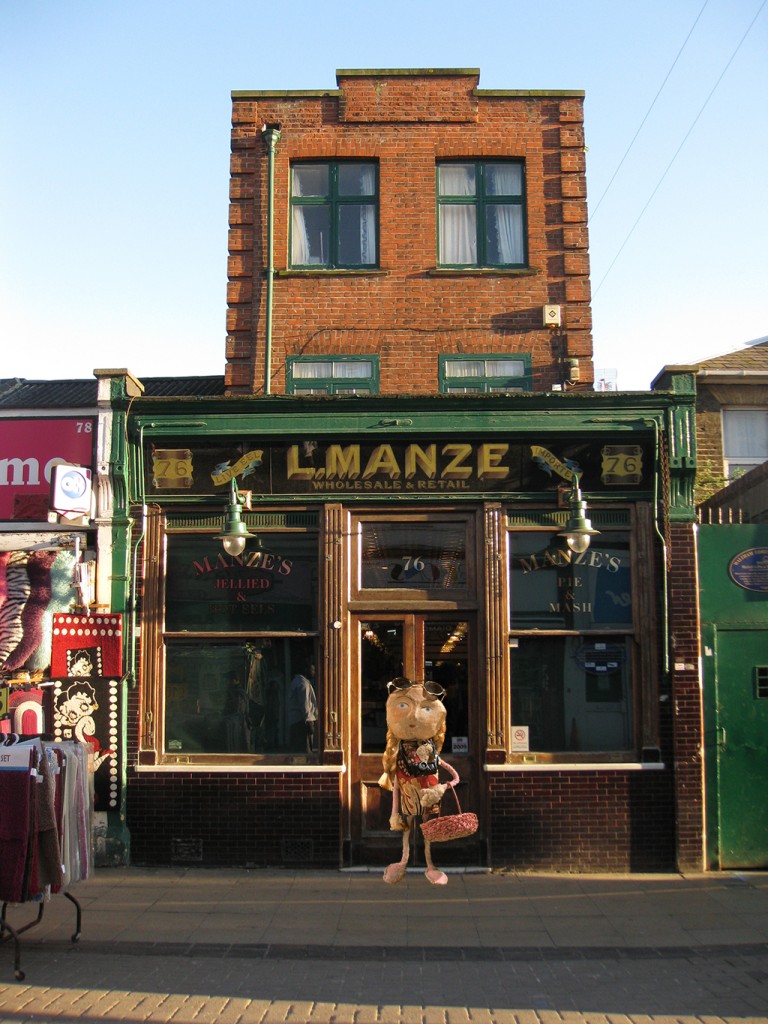 Random Person outside the Pie and Mash cafe in Walthamstow Market