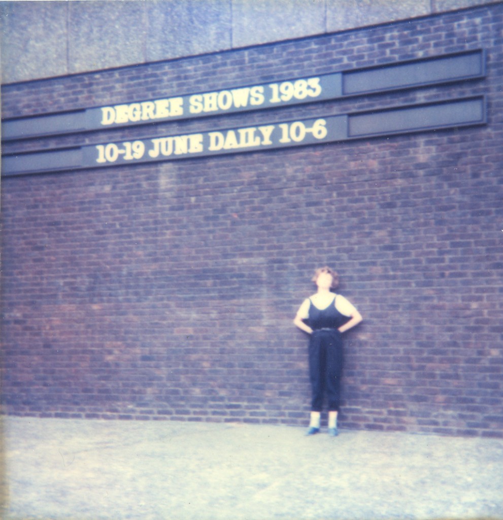 Emma Calder standing by Royal College oOf Art wall